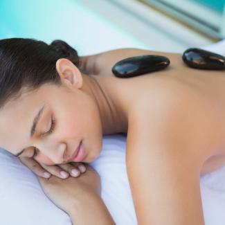 Hot Stone Massage - Woman in hot stone treatment