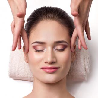 Woman getting facial massage